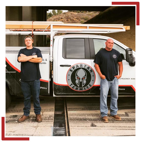Members of the Spartan Termite team standing in front of work truck